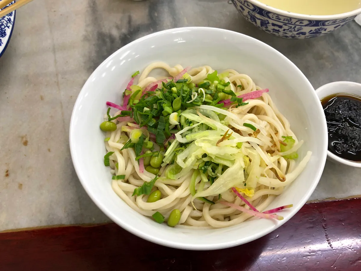 Beijing zhajiangmian topped with pork bean sauce and vegetables