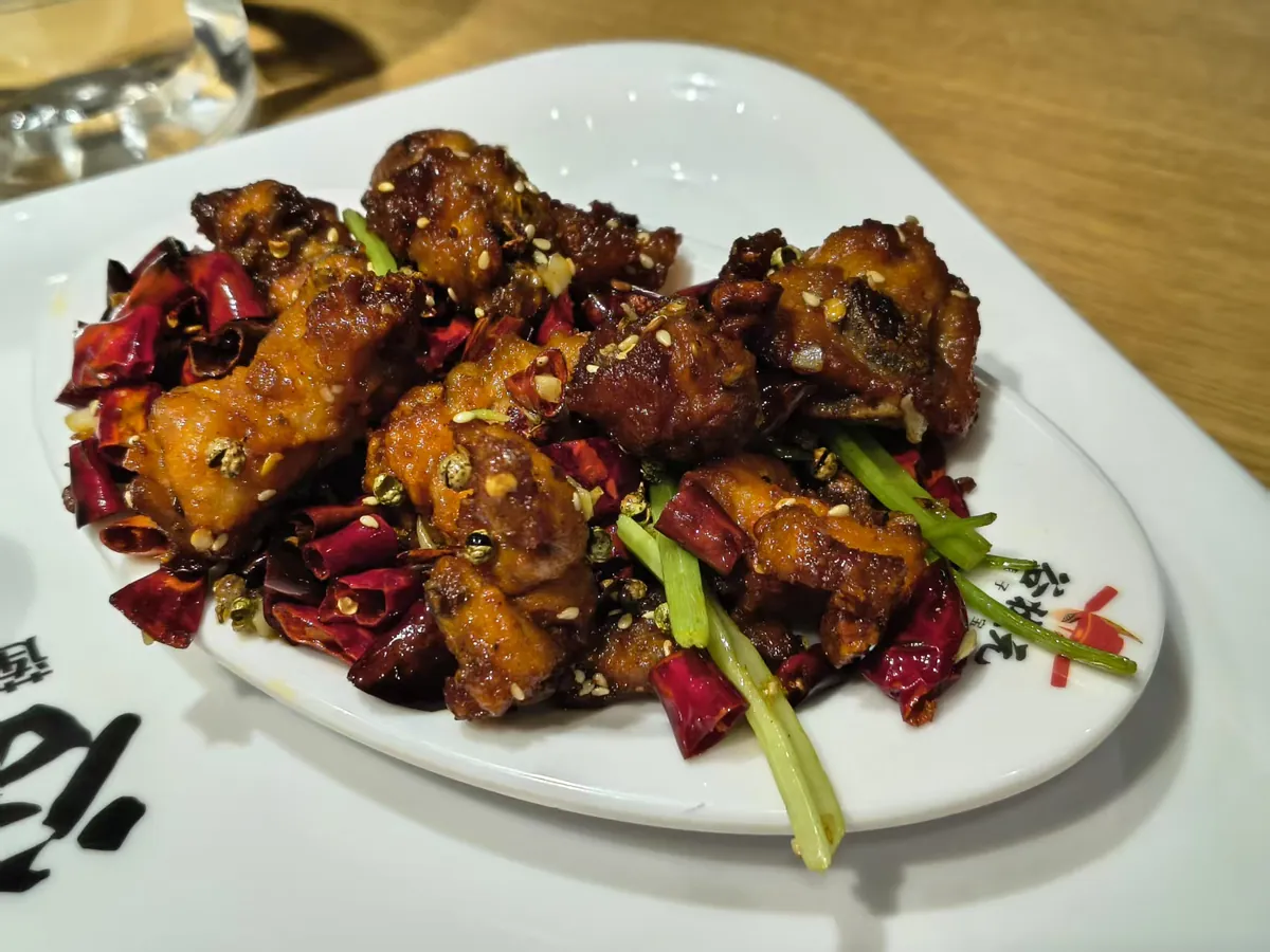 Crisp laziji chicken among dried chilies and Sichuan pepper