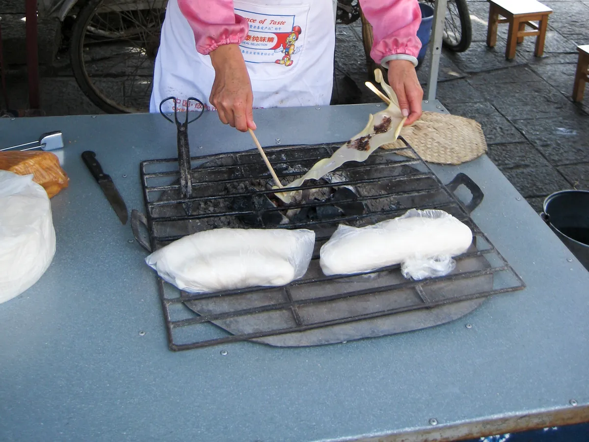 Dali rushan cheese roasting over charcoal with sugar