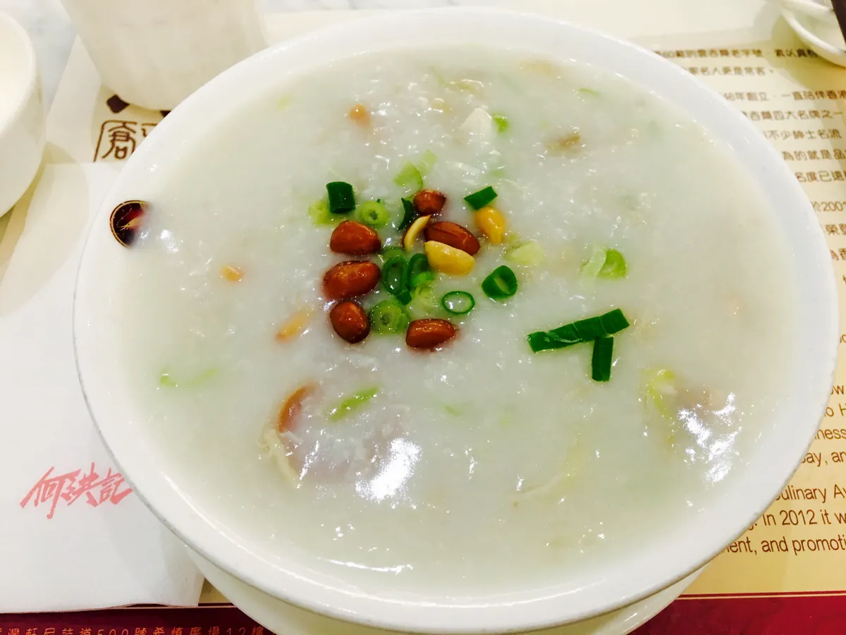 Sampan congee with fish and crisp garnishes