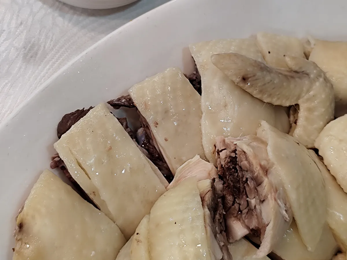 Sliced Hainan Wenchang chicken served on a plate