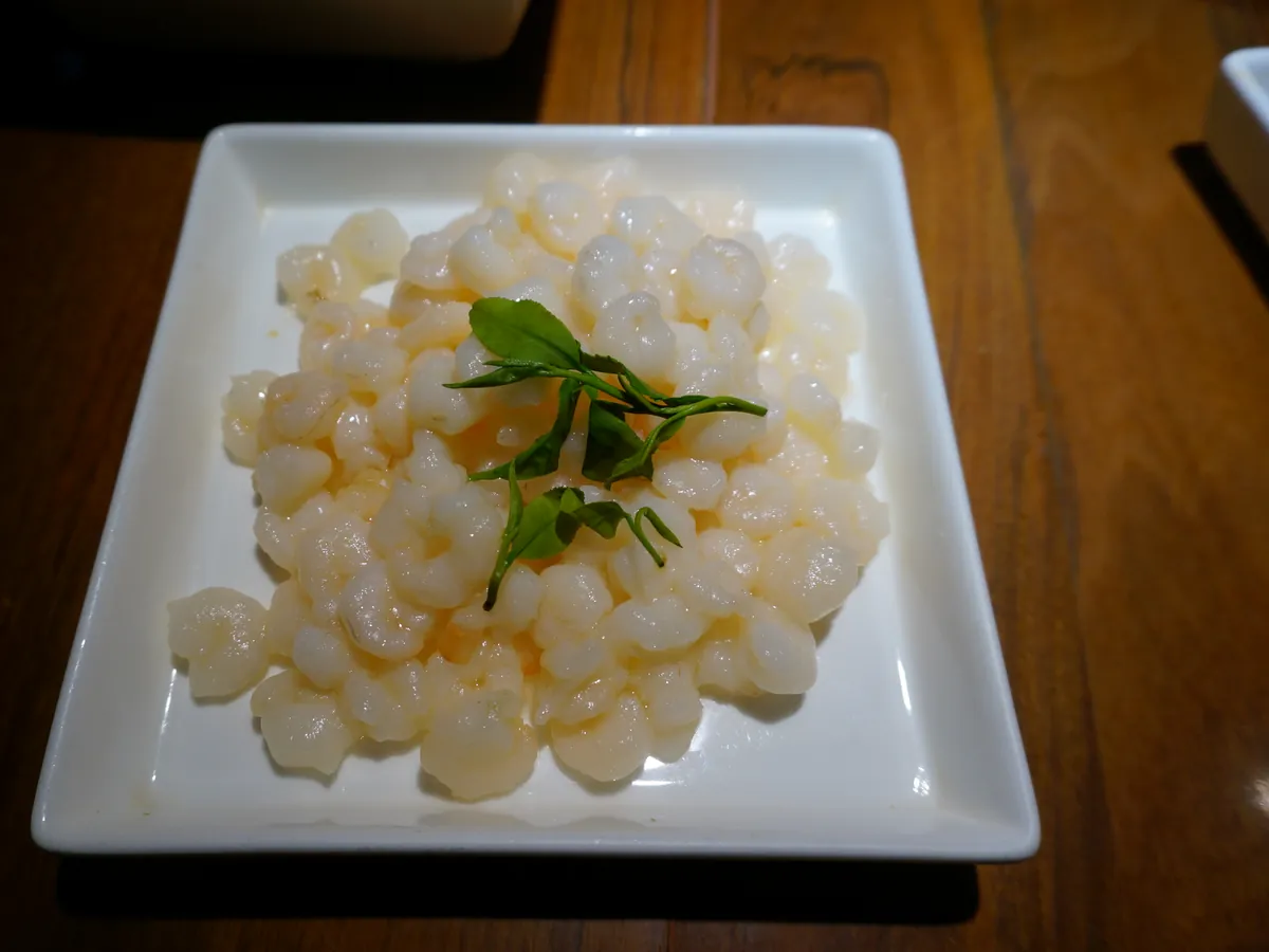 Hangzhou Longjing prawns garnished with tea leaves