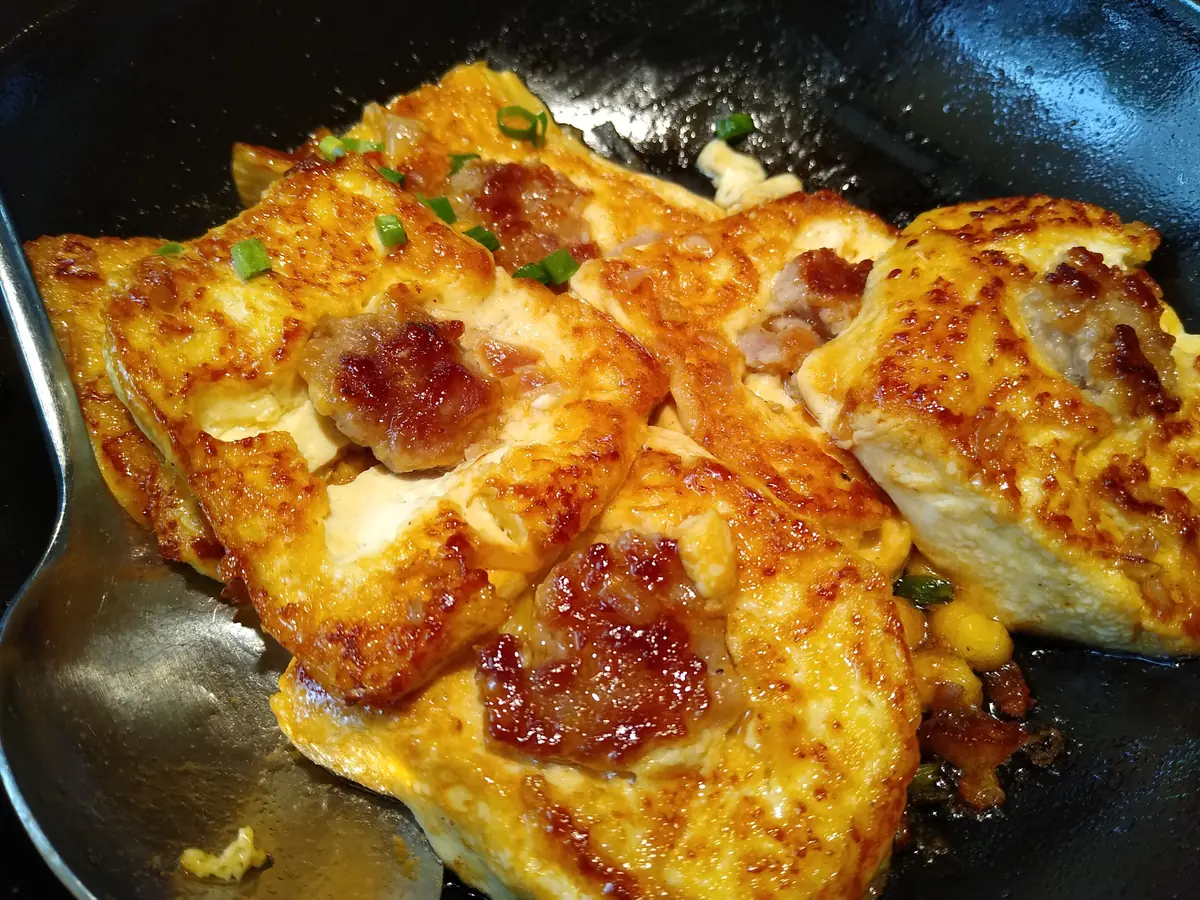 Golden pan-seared tofu filled with seasoned pork